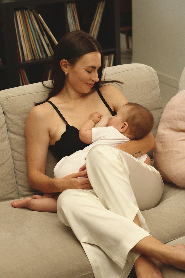 Breastfeeding mother using the Mumma Milla clip-free wire free bralette with sweetheart neckline