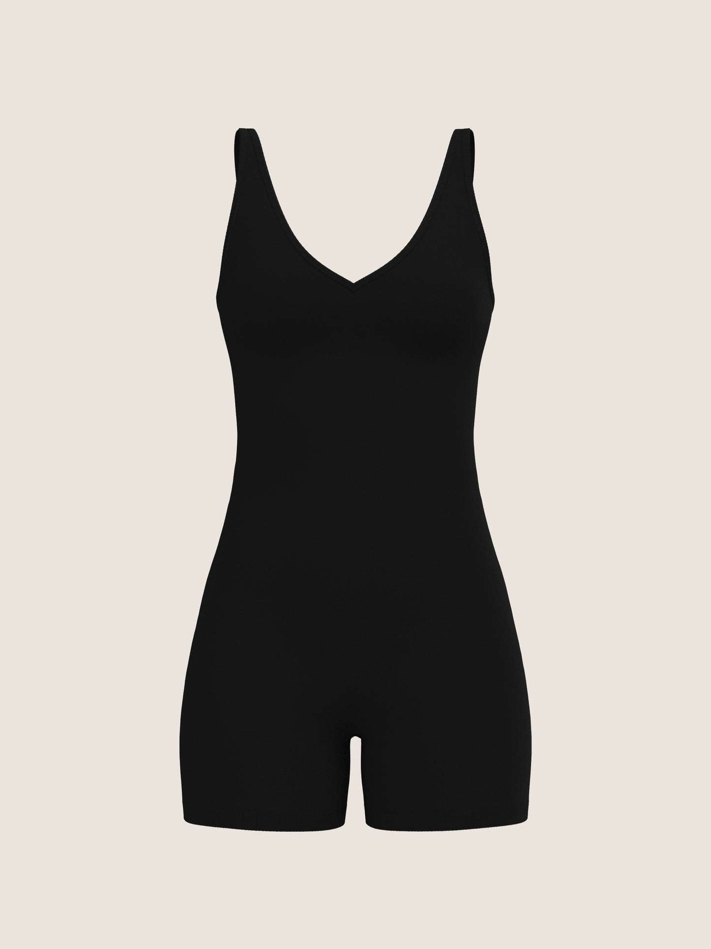 Black bodysuit on a beige background