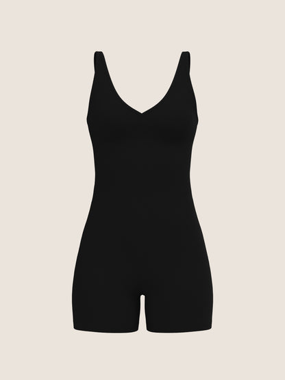 Black bodysuit on a beige background