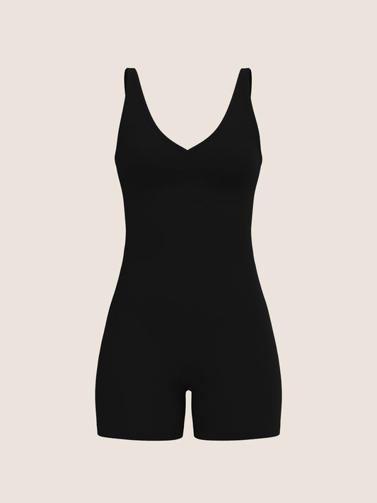 Black bodysuit on a beige background