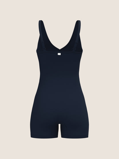 NAvy bodysuit on a beige background