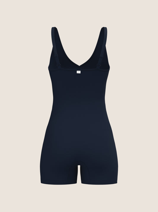 NAvy bodysuit on a beige background